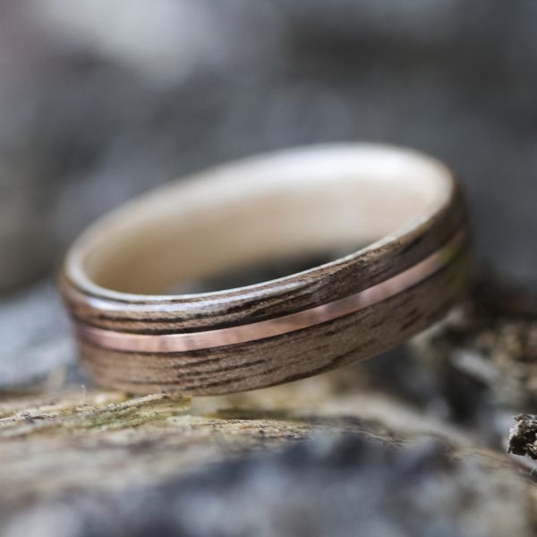 Walnut wood ring lined with maple and copper inlay