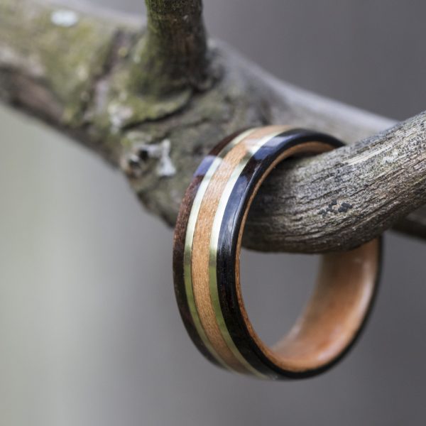 Ebony bentwood ring lined with cherry and inlaid with yellow brass and cherry