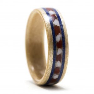 Maple wood ring inlaid with red jasper, howlite, and lapis lazuli