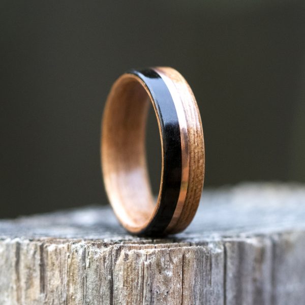 Cherry and ebony wooden ring lined cherry and inlaid with copper