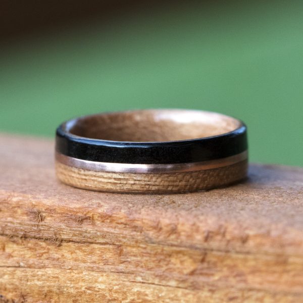 Cherry and ebony wooden ring lined cherry and inlaid with copper