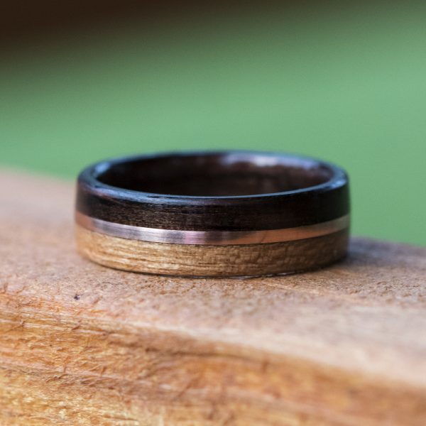 Ebony and cherry wood ring inner lined with ebony and copper inlay