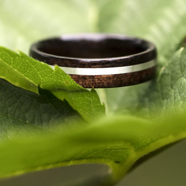 Ebony wooden ring with silver inlay