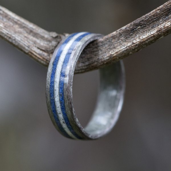 Gray birdseye maple wooden ring inlaid with lapis lazuli and howlite