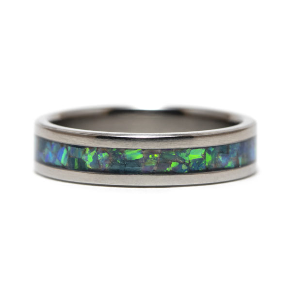 Titanium ring with turquoise colored opal inlay