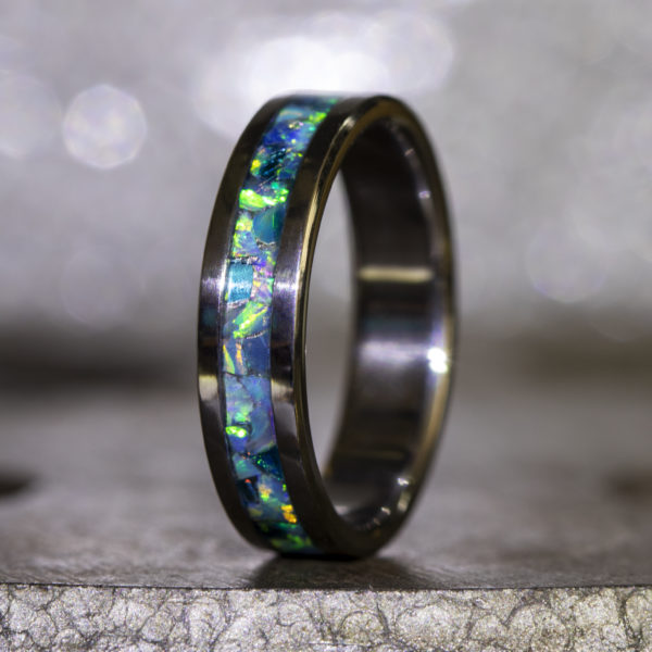 Titanium ring inlaid with opal