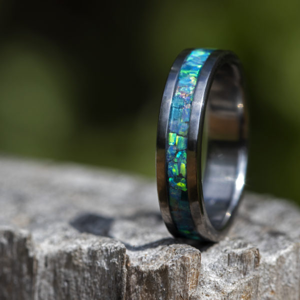 Titanium ring with turquoise colored opal inlay